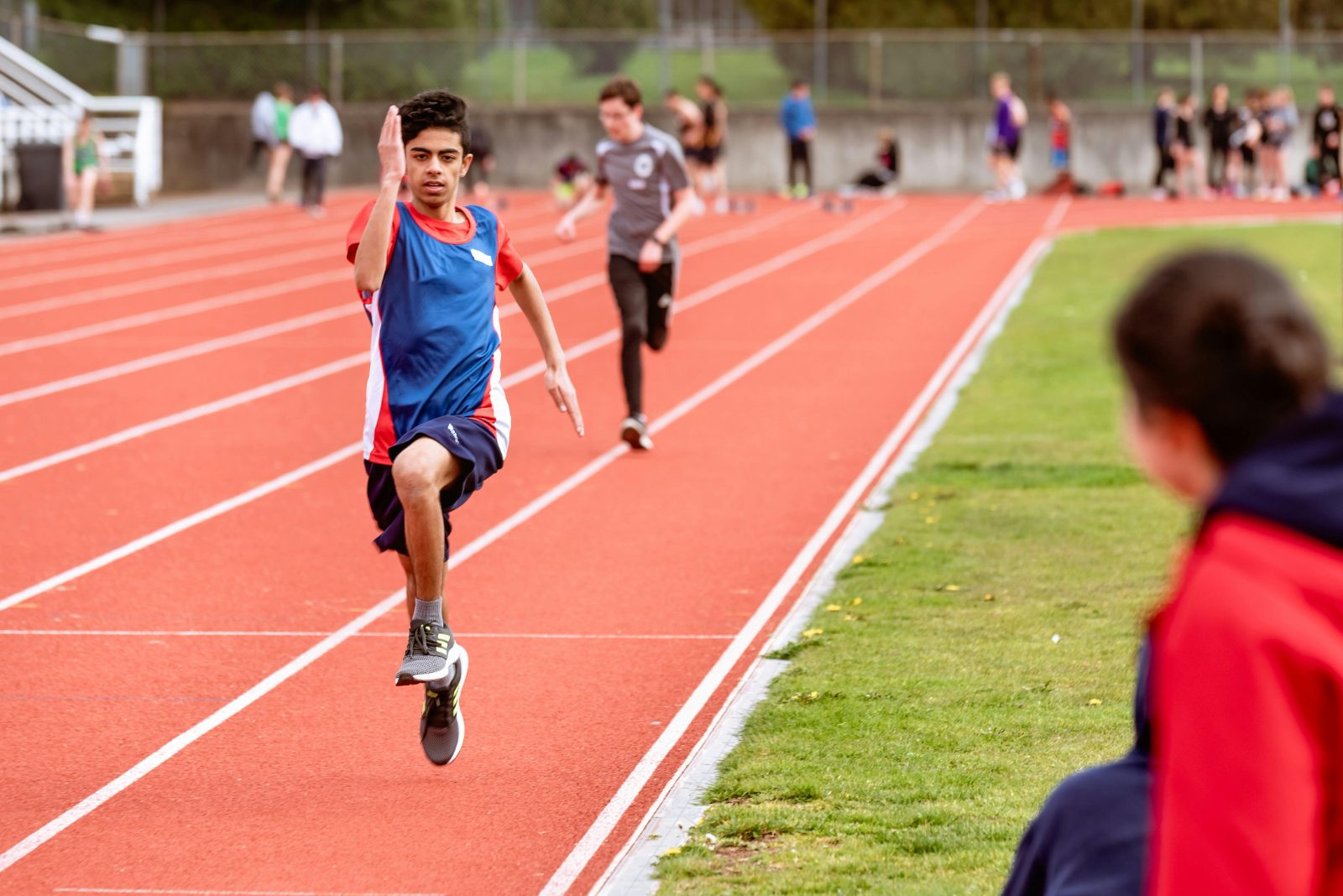 Young athlete sprinting on a track